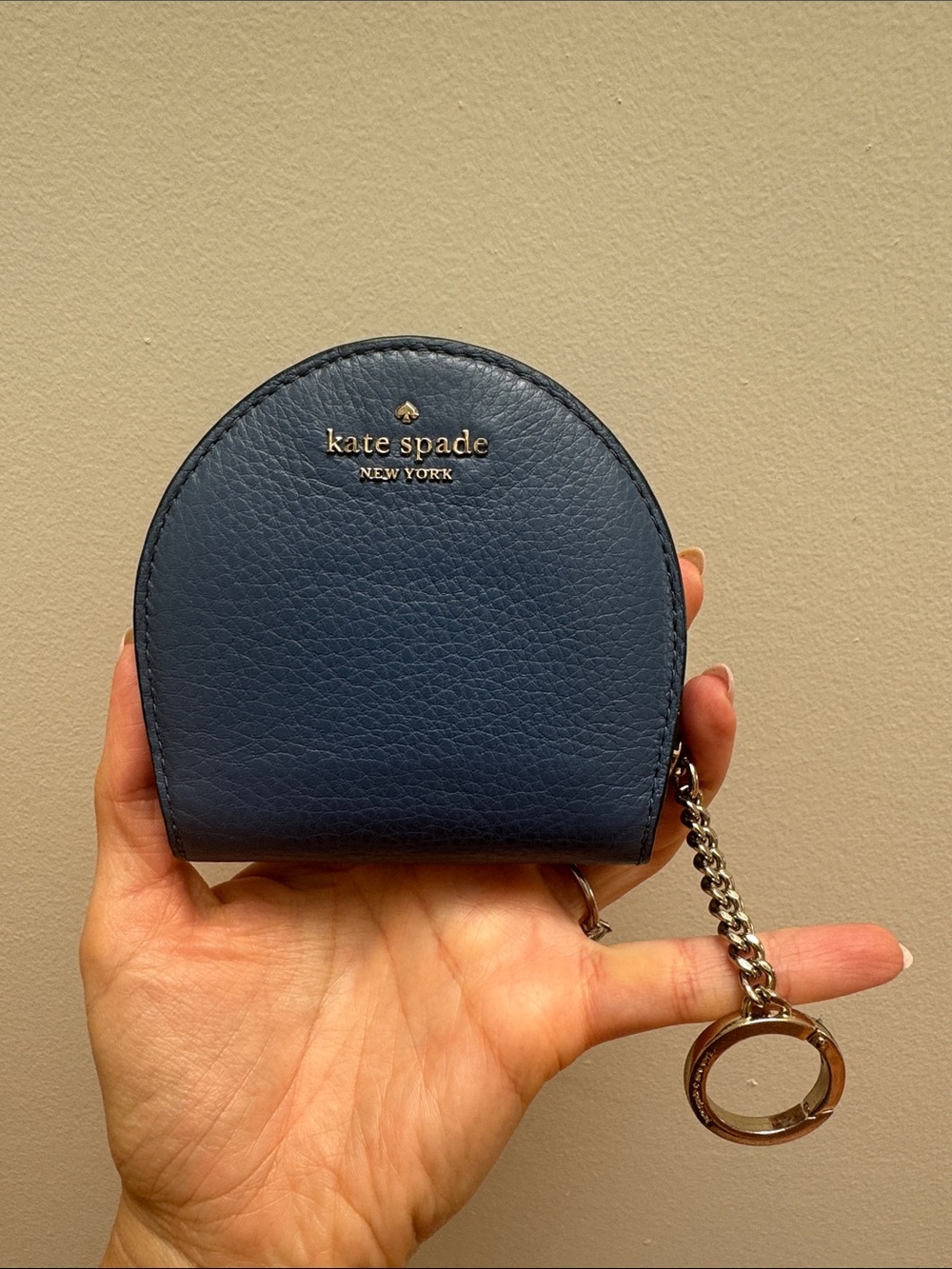 Kate Spade New York half moon keychain wallet in blue pebbled leather